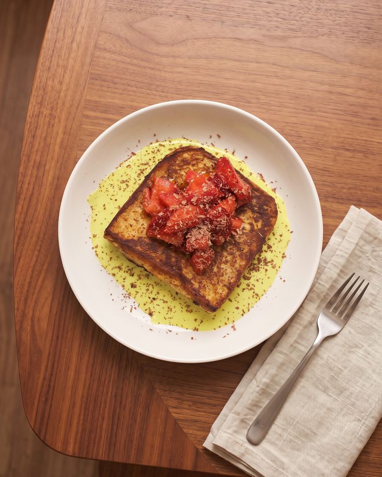 Pistachio French Toast with macerated strawberries and dark chocolate